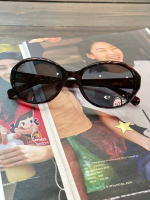 Солнцезащитные очки Uniqlo овальные темно-коричневые 5263 фото